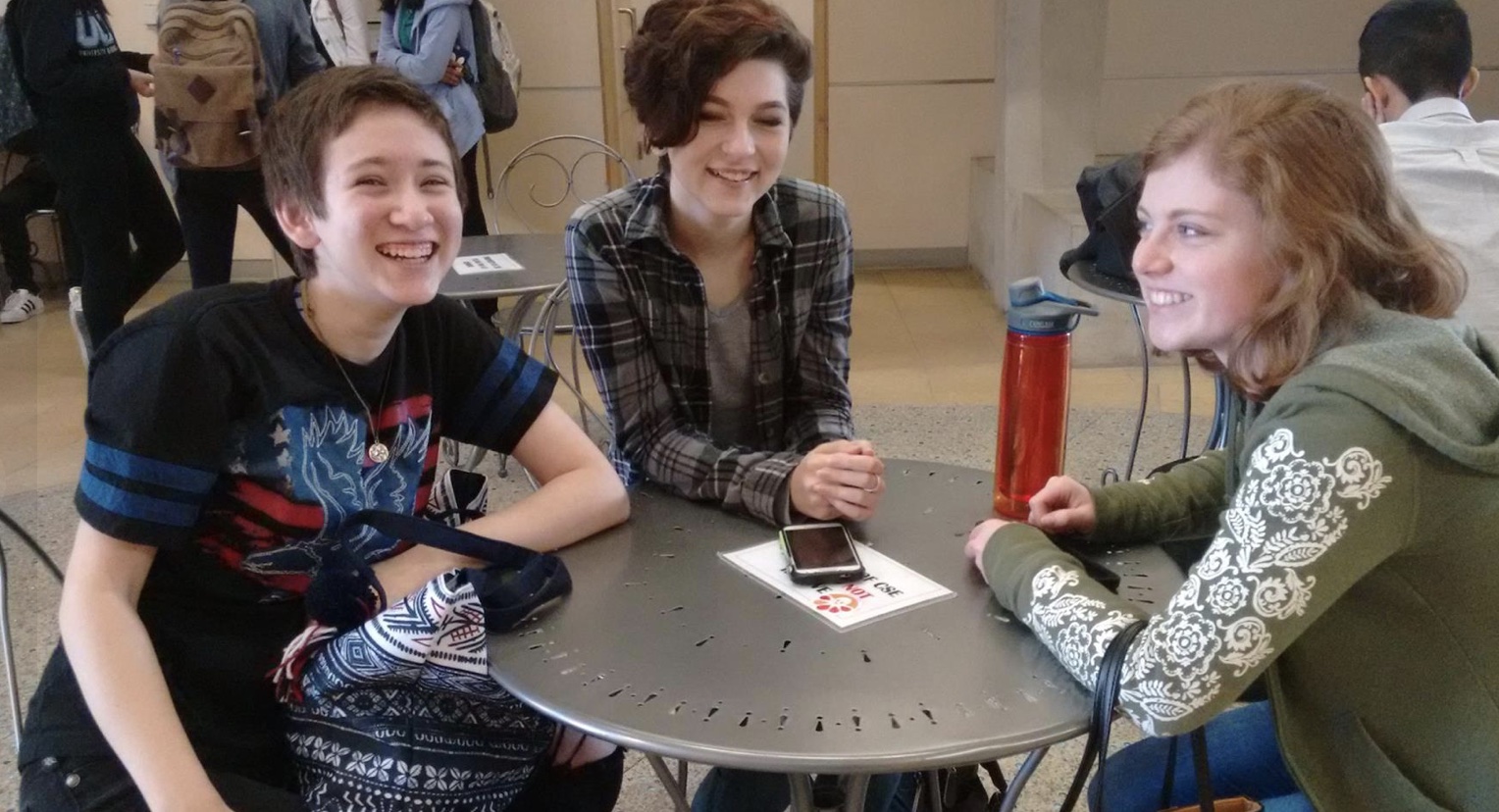 A group of 3 SET High students enjoying a break between classes